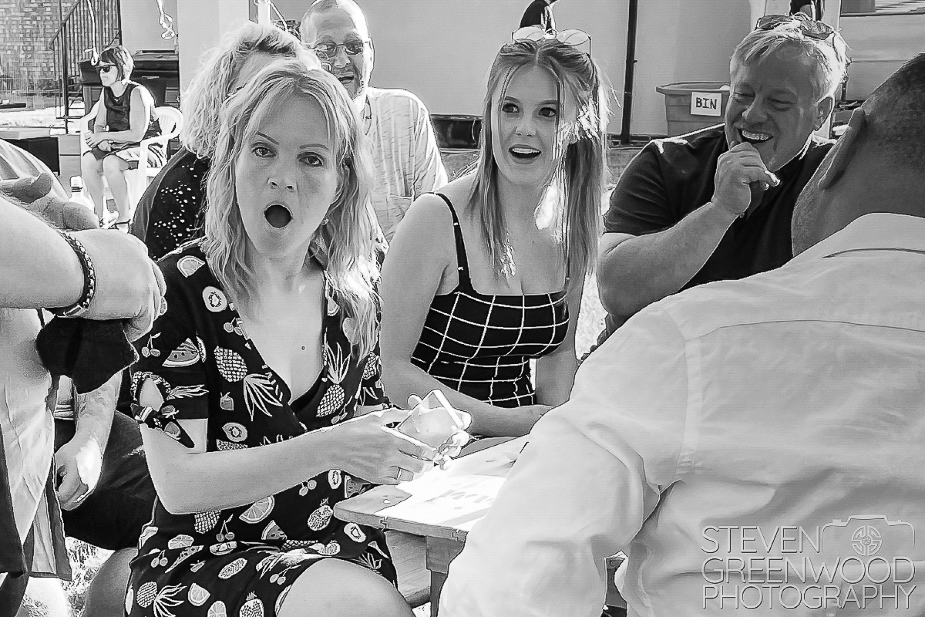 Wedding guests reacting with surprise during Steven Greenwood’s close-up magic